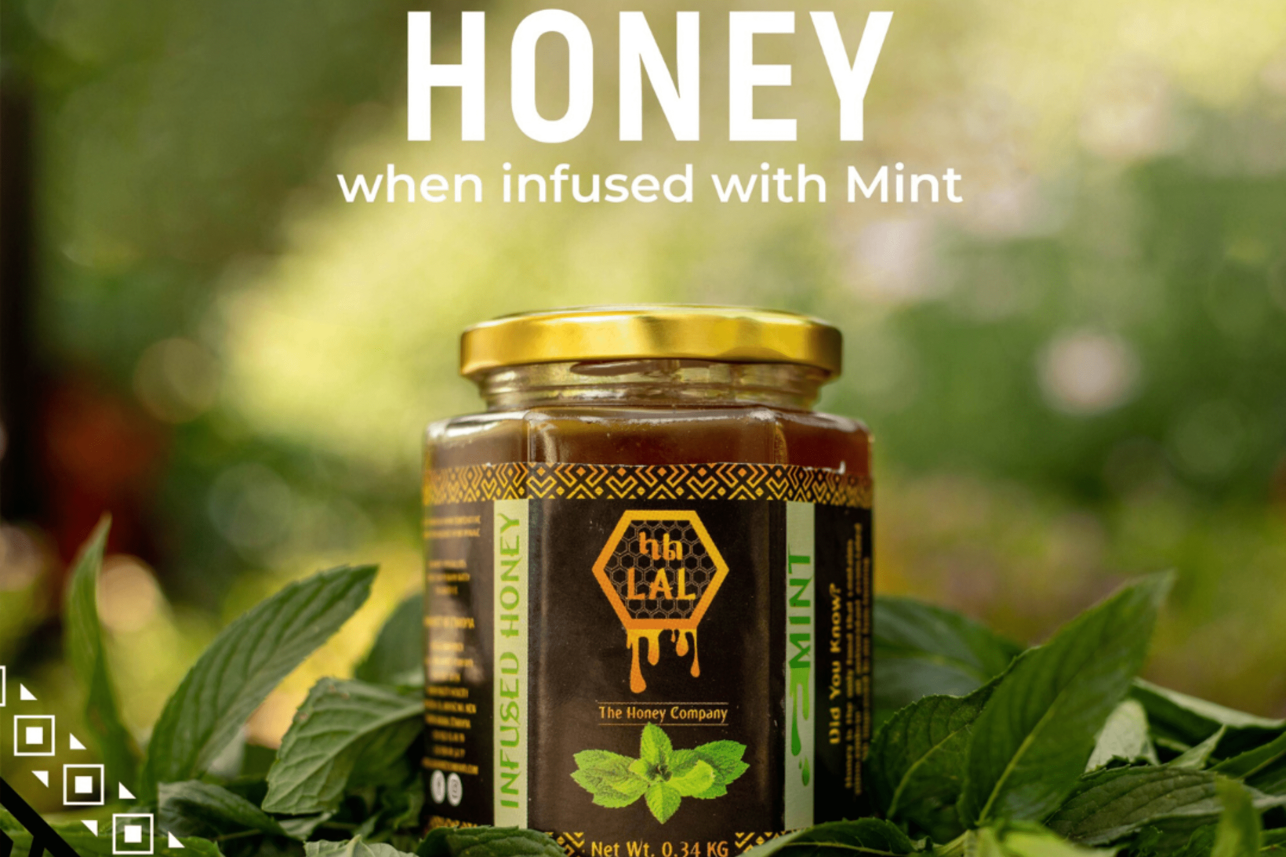 A jar of mint honey with fresh mint leaves around it