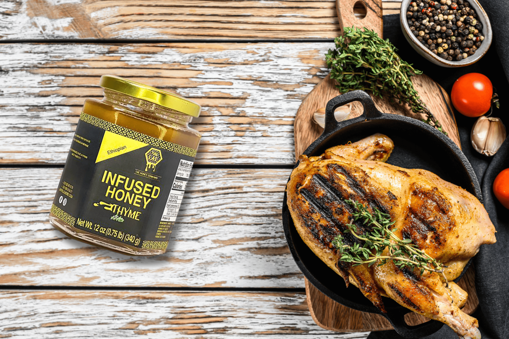 Thyme chicken dish with a bottle of Lal's thyme-infused honey on the side